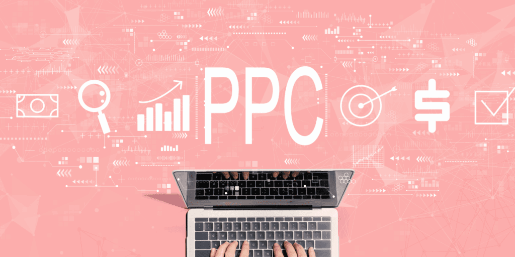A hand on a laptop with marketing symbols and PPC above it