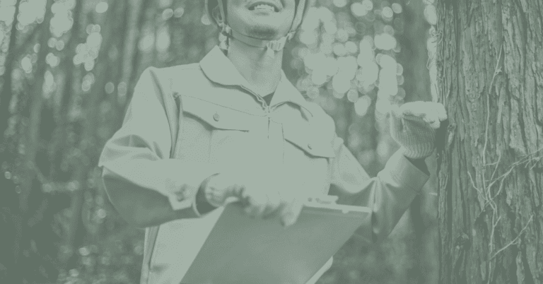 A man with a clipboard stands at a tree